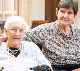 Two friends offering company to each other in our Lincoln Care Home