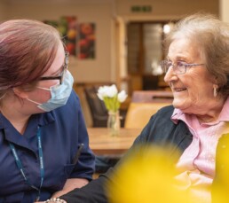 A resident and carer spending time together in our lincoln care home